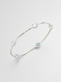 From the Rock Candy® Collection. Five faceted blue topaz stations set on a hammered sterling silver bangle. Blue topazSterling silverDiameter, about 2.5Slip-on styleImported 