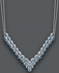 Give new meaning to a plunging neckline. This glamorous v-shaped necklace features two beautiful rows of oval-cut blue topaz (20 ct. t.w.). Set in sterling silver with a double chain design. Approximate length: 18 inches. Approximate drop width: 3 inches.