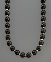 A dramatic and striking necklace featuring onyx beads (8 mm) separated by polished 14k gold beads. Length measures 30 inches.