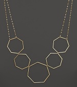 A modern statement necklace in yellow gold from Lana.