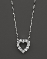 From the Tiny Treasures collection, a baby heart diamond necklace; with signature ruby accent. Designed by Roberto Coin.