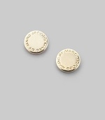 Polished disc-shaped studs, carved with the iconic designer's logo. Brass Diameter, about ¼ Post back Imported