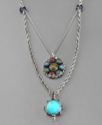 Lifestyle jewelry you love. This laid-back necklace by Lucky Brand features a smooth blue pendant accented by a multicolored flower charm. Crafted in vintage silvertone mixed metal. Approximate length: 20 inches + 2-inch extender. Approximate charm drops: 1 inch and 1-3/4 inches.