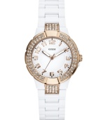 Rosy hues burst from a refined background on this shimmering timepiece from GUESS.