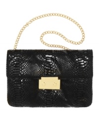 Sleek and chic, the Sloan clutch purse by MICHAEL Michael Kors also flaunts an optional chain strap.